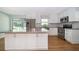Modern kitchen featuring stainless steel appliances, an island, and ample cabinet space at 2809 Sanbina St, Winter Park, FL 32789