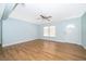 Inviting living room with modern flooring, ceiling fan, and a freshly painted accent wall at 2809 Sanbina St, Winter Park, FL 32789