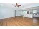 Bright and airy living room flows into the modern kitchen, featuring sleek hardwood floors at 2809 Sanbina St, Winter Park, FL 32789