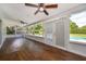 This sunroom has a nice view of the pool and a ceiling fan at 2809 Sanbina St, Winter Park, FL 32789