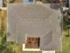 Aerial view of the roof of the home with well maintained yard and manicured flower beds at 2823 Ne 24Th Pl, Ocala, FL 34470