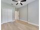 Bedroom features a ceiling fan, closet, and doorway leading to an adjacent room at 2823 Ne 24Th Pl, Ocala, FL 34470