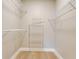 Walk-in closet with wire shelving for ample storage and light wood flooring at 2823 Ne 24Th Pl, Ocala, FL 34470
