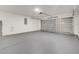 Clean, spacious two car garage with a concrete floor and an automatic door at 2823 Ne 24Th Pl, Ocala, FL 34470