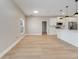 Bright kitchen with white cabinets, hardwood floors, and stainless-steel appliances at 2823 Ne 24Th Pl, Ocala, FL 34470