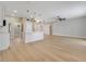 Kitchen showcasing modern white cabinets, pendant lights, and hardwood flooring at 2823 Ne 24Th Pl, Ocala, FL 34470
