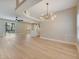 Bright living room featuring hardwood floors, modern lighting, and an open floor plan at 2823 Ne 24Th Pl, Ocala, FL 34470