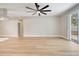 Open-concept living room with hardwood flooring and natural light streaming in at 2823 Ne 24Th Pl, Ocala, FL 34470