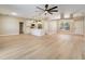 Open living area with a kitchen featuring white cabinets and a kitchen island at 2823 Ne 24Th Pl, Ocala, FL 34470