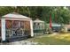 The backyard features outdoor seating areas with canopies for comfortable relaxation and entertainment in a private setting at 31701 State Road 44 Sr-44, Eustis, FL 32736
