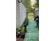 Gardening plot alongside the shed, complete with potted plants and a turf walkway at 31701 State Road 44 Sr-44, Eustis, FL 32736