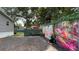 The expansive yard includes vibrant garden decor, gravel areas, and lush greenery for a serene outdoor experience at 31701 State Road 44 Sr-44, Eustis, FL 32736