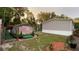 Backyard with green space, a shed, and an array of greenery and landscaping at 31701 State Road 44 Sr-44, Eustis, FL 32736
