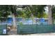 Backyard landscape with custom privacy screen featuring a tropical beach scene at 31701 State Road 44 Sr-44, Eustis, FL 32736