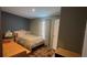 Bedroom featuring a large window, wood-look floors, and neutral-toned walls at 31701 State Road 44 Sr-44, Eustis, FL 32736