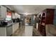 Efficient kitchen with white cabinets, dark countertops, and an island, offering ample space for cooking and storage at 31701 State Road 44 Sr-44, Eustis, FL 32736