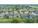 Aerial view of a residential neighborhood featuring well-maintained homes and lush green landscaping at 31961 Redtail Reserve Blvd, Sorrento, FL 32776