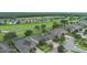 A panoramic aerial view of a residential area, showcasing well-maintained homes, lush greenery, and a serene setting at 31961 Redtail Reserve Blvd, Sorrento, FL 32776