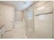 Bright bathroom featuring a walk-in shower and separate tub with white subway tile and marble flooring at 31961 Redtail Reserve Blvd, Sorrento, FL 32776