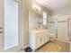 Bathroom with natural light, a glass-enclosed shower, and neutral tile flooring at 31961 Redtail Reserve Blvd, Sorrento, FL 32776