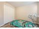Bedroom with wood-look floors featuring a train table, toy airplane, and a large closet at 31961 Redtail Reserve Blvd, Sorrento, FL 32776