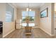 Bright breakfast nook with a decorative glass table and backyard views at 31961 Redtail Reserve Blvd, Sorrento, FL 32776