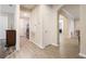 Hallway with tile flooring and access to various rooms in the house at 31961 Redtail Reserve Blvd, Sorrento, FL 32776