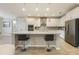 Spacious kitchen with an island, bar seating, stainless steel appliances, and modern cabinetry at 31961 Redtail Reserve Blvd, Sorrento, FL 32776