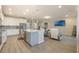 Open floor plan featuring kitchen, living room with TV, and comfortable seating; a perfect gathering space at 31961 Redtail Reserve Blvd, Sorrento, FL 32776