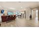 Expansive living area showcasing tile floors, an open layout, and seamless flow into the kitchen at 31961 Redtail Reserve Blvd, Sorrento, FL 32776