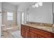 Bathroom featuring double sink vanity, tiled shower, and neutral finishes at 3713 Ocita Dr, Orlando, FL 32837