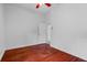 Bedroom with hardwood floors and view into ensuite bathroom at 3713 Ocita Dr, Orlando, FL 32837