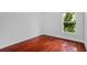 Bedroom featuring gleaming hardwood floors and a window at 3713 Ocita Dr, Orlando, FL 32837