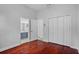 Bedroom features gleaming hardwood floors and an adjoining bathroom at 3713 Ocita Dr, Orlando, FL 32837