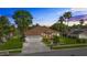 Charming single-Gathering home featuring a well-manicured lawn, mature trees and landscaping, and a two-car garage at 3713 Ocita Dr, Orlando, FL 32837