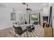 Bright living room with a fireplace, comfortable seating, and a view of the pool area at 3713 Ocita Dr, Orlando, FL 32837