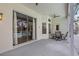 Covered patio with ceiling fan and dining set at 3713 Ocita Dr, Orlando, FL 32837