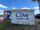 Community entrance sign for The Cove at Storey Lake with a stone base at 4751 Clock Tower Dr # 304, Kissimmee, FL 34746