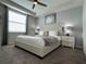 Inviting main bedroom features a large, comfortable bed and soft, neutral decor at 4751 Clock Tower Dr # 304, Kissimmee, FL 34746