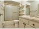 The bathroom features a vanity, a toilet, and a shower with sliding glass doors at 513 Hunter Cir # 513, Kissimmee, FL 34758