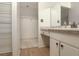 Bright bathroom featuring white fixtures and a spacious walk-in closet area at 513 Hunter Cir # 513, Kissimmee, FL 34758
