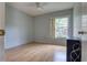 The bedroom features hardwood floors and a large window for natural light at 513 Hunter Cir # 513, Kissimmee, FL 34758