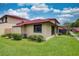 The exterior of this home features well manicured lawn and a red tile roof at 513 Hunter Cir # 513, Kissimmee, FL 34758