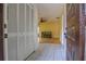The foyer features tiled floors, closet, and a glimpse into the living area at 513 Hunter Cir # 513, Kissimmee, FL 34758