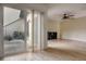 The living area features hardwood floors, fan, sliding glass doors to the outside patio at 513 Hunter Cir # 513, Kissimmee, FL 34758