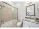 Modern bathroom boasts a granite countertop, sliding glass shower doors, and ample space at 528 Greely St, Orlando, FL 32804