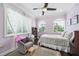 Comfortable bedroom with star curtains, a chair, and hardwood flooring at 528 Greely St, Orlando, FL 32804