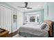 Cozy bedroom featuring a bay window, light blue walls, and a ceiling fan at 528 Greely St, Orlando, FL 32804