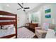 Charming bedroom features bunk beds, a window, and hardwood flooring at 528 Greely St, Orlando, FL 32804