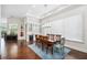 Elegant dining room with hardwood floors, tray ceiling, wet bar, and ample natural light at 528 Greely St, Orlando, FL 32804
